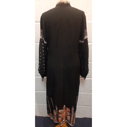 86 - A vintage black hand embroidered female kaftan, having bellow sleeves with hand embroidered cuffs, a... 