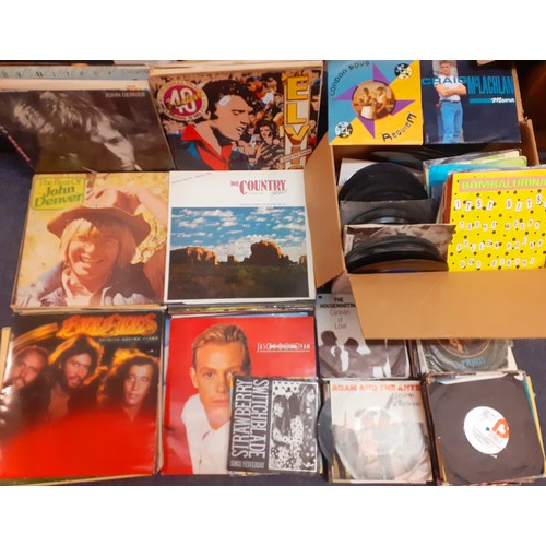 142 - A quantity of LP's, mainly 1970's to include Elvis, The Bee Gees and John Denver together with a lar... 