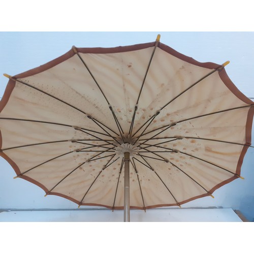 35 - An Edwardian parasol 'The Armstrong', British made, having a gold coloured silk fabric with hand pri... 