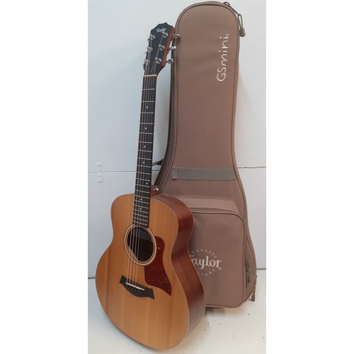 133 - A Taylor GSmini 6-string acoustic guitar with branded padded case, accessories and spare strings, se... 