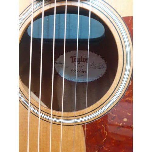 133 - A Taylor GSmini 6-string acoustic guitar with branded padded case, accessories and spare strings, se... 