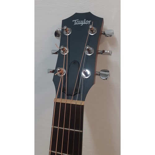 133 - A Taylor GSmini 6-string acoustic guitar with branded padded case, accessories and spare strings, se... 