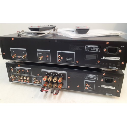 136 - A Marantz integrated amplifier PM6007 with remote, cables and instruction manual together with a Mar... 