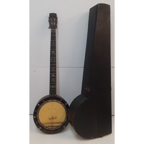 140 - A late 19th Century banjo A/F having mother of pearl inlay and a black wooden case. Location:RWF 
Co... 