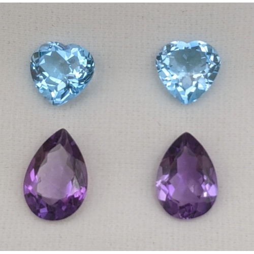 112 - Four gem stones 20ct, to include two heart shaped natural blue topaz, together with two cut amethyst... 