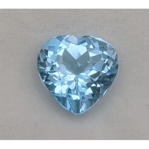 114 - A 9ct  heart faceted cut topaz gemstone, 12.94 mm x 13.12mm x 8.51mm with a AIG certificate of authe... 