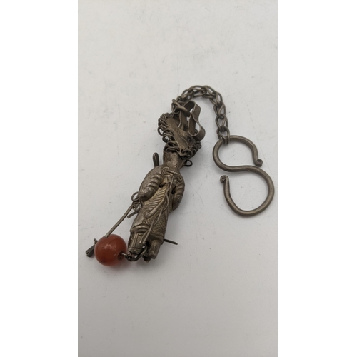 33 - A Chinese silver chatelaine figure, approx 9cm long excluding chain, 20.3g
Location: A2T
If there is... 