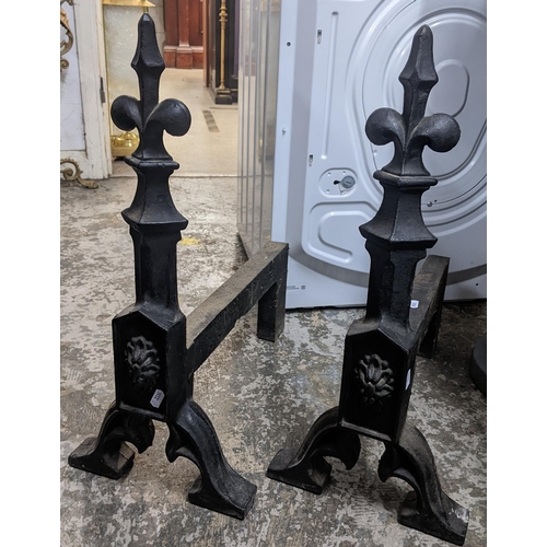 171 - A pair of cast iron fire dogs in the gothic style with fleur-de-lis finials, 57.5h x 25.5w
Location:... 