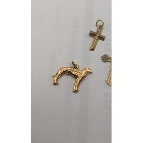 11 - Mixed 9ct gold jewellery to include a pendant fashioned as a greyhound dog, along with two cross pen... 