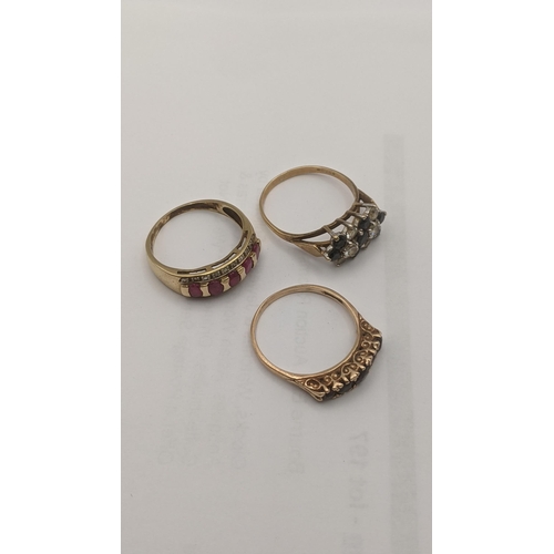 42 - Three 9ct gold ladies rings to include a blue sapphire and paste stone cluster ring, a five stone ga... 