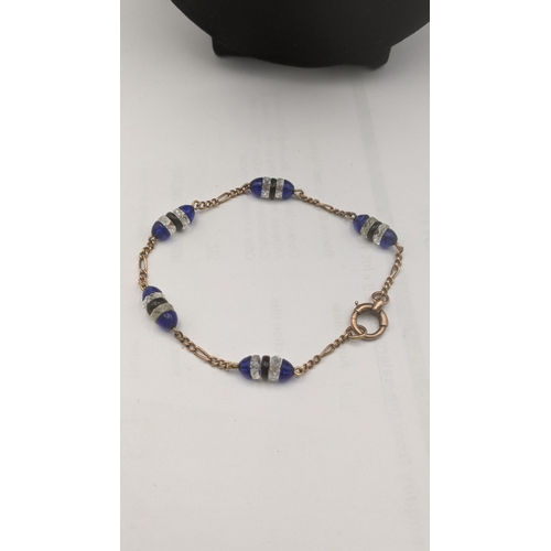 53 - A 9ct gold necklace and bracelet set with blue and clear glass beads total weight 15.7g
Location:CAB... 