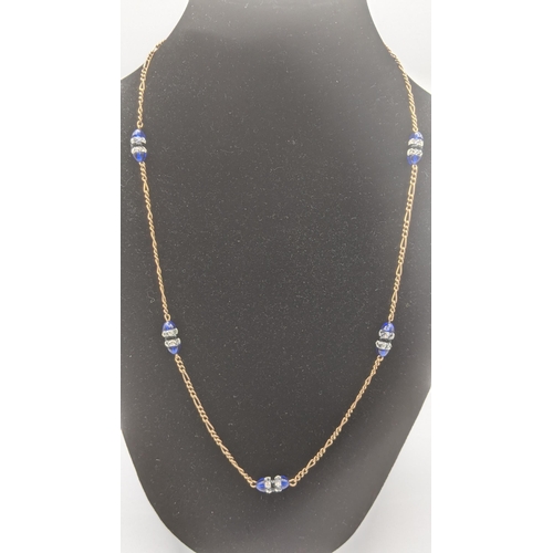 53 - A 9ct gold necklace and bracelet set with blue and clear glass beads total weight 15.7g
Location:CAB... 