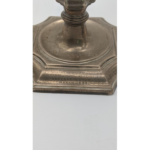 55 - A silver weighted candlestick and vase, each engraved 
Location:A2T
If there is no condition report ... 