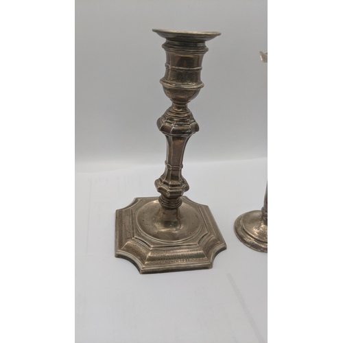 55 - A silver weighted candlestick and vase, each engraved 
Location:A2T
If there is no condition report ... 