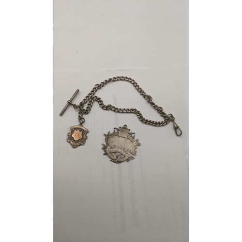 61 - Silver to include a pocket watch chain and T-bar, a silver fob, a silver pendant and silver plated b... 