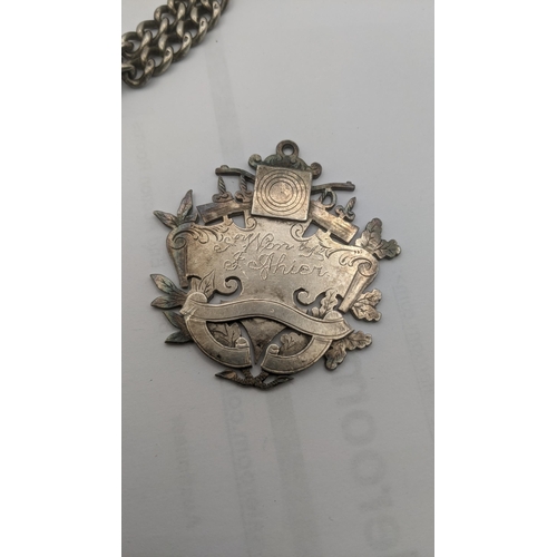 61 - Silver to include a pocket watch chain and T-bar, a silver fob, a silver pendant and silver plated b... 