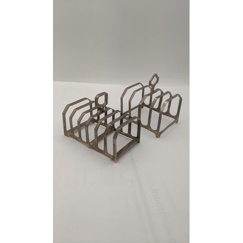 64 - Two silver toast racks to include one example made by Charles William Fletcher and sons hallmarked 1... 