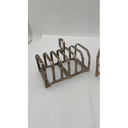 64 - Two silver toast racks to include one example made by Charles William Fletcher and sons hallmarked 1... 