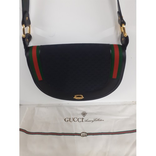 4 - Gucci-A vintage black leather shoulder bag approx 29cm wide x 23cm high having a double GG monogram ... 