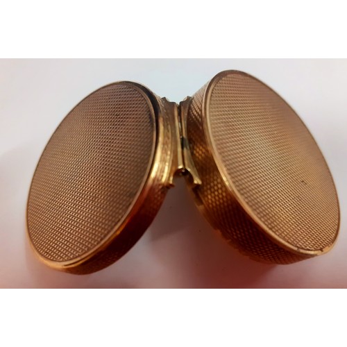 5 - Asprey-A 9ct gold compact box having an engine turned lid with internal mirror, approx 3cm diameter,... 