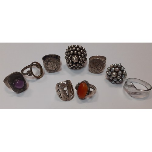 107 - A selection of silver and white metal fashion rings to include a Gini Boston ring together with earr... 