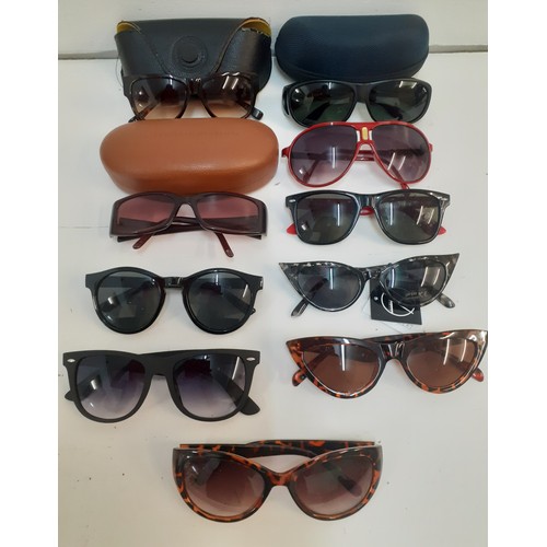 33 - Tommy Hilfiger-A pair of ladies designer brown prescription sunglasses with case together with a pai... 