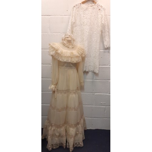 99 - A 1970's cream wedding dress UK10 with tiered skirt and lace insertions, together with a white tiara... 