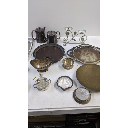 107 - A collection of mostly silver plate to include a tea and coffee pot, trays, condiment set, coasters,... 