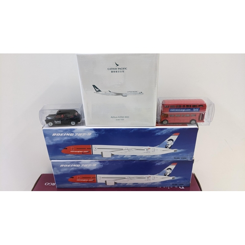 113 - A collection of boxed die cast toys to include a boxed Cathay Pacific Airbus A350-900, a boxed Vangu... 