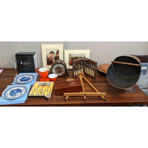 118 - A mixed lot to include a coal scuttle, a bed pan, flatware, commemorative plates, a Smith's mantel c... 