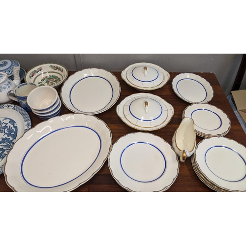 119 - A collection of tea and dinner ware to include a blue and white Grindley cream petal part dinner ser... 