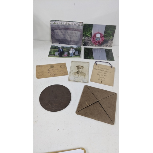 125 - A WWI Death Plaque entitled to Archibald Lane together with his photograph, Field Service postcard a... 