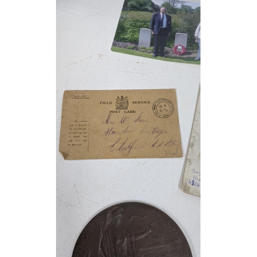 125 - A WWI Death Plaque entitled to Archibald Lane together with his photograph, Field Service postcard a... 