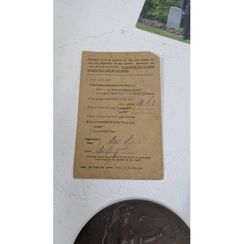 125 - A WWI Death Plaque entitled to Archibald Lane together with his photograph, Field Service postcard a... 