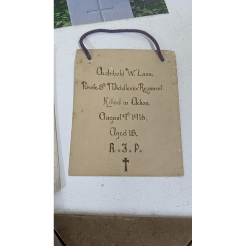 125 - A WWI Death Plaque entitled to Archibald Lane together with his photograph, Field Service postcard a... 