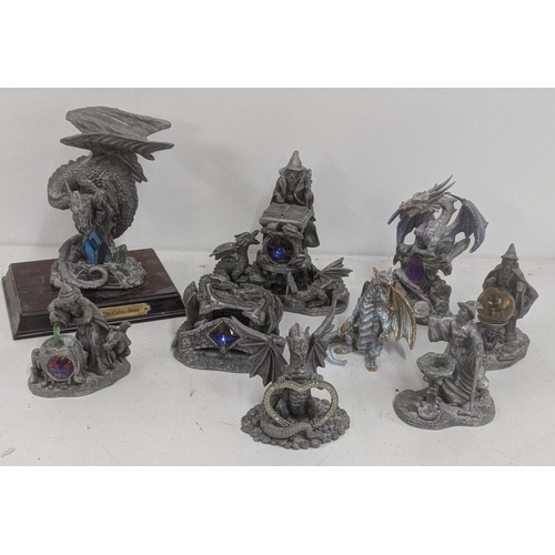 127 - A group of seven Tudor mint pewter figures to include Guardian of the Celtic Stone, on a plinth, The... 