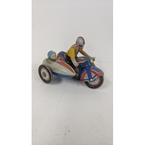 160 - Toys to include a vintage wind-up Tin toy Litho Graphics motorcycle and sidecar, together with Match... 