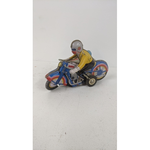 160 - Toys to include a vintage wind-up Tin toy Litho Graphics motorcycle and sidecar, together with Match... 