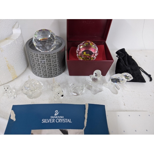 53 - Swarovski to include Collectors Society Charter crystal pieces, white gloves and Swarovski polishing... 