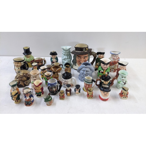 66 - A collection of Toby jugs to include Burlington ware examples, A Shorter & Son Toby and teapot, a Ro... 