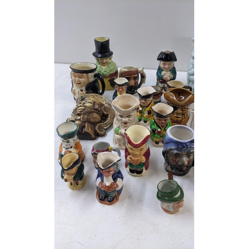 66 - A collection of Toby jugs to include Burlington ware examples, A Shorter & Son Toby and teapot, a Ro... 