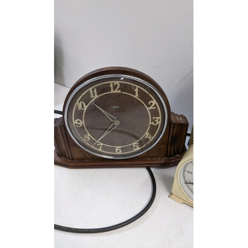 86 - A collection of vintage clocks to include a Smiths timer, a Metamec electric mantle clock without pl... 