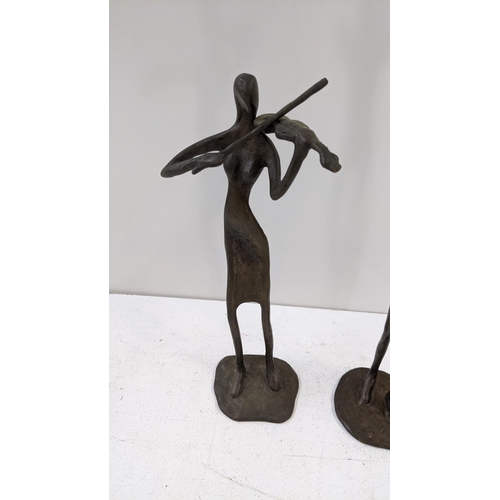 92 - Two bronzed figures depicting a violin and trumpet player
Location: 1-3
If there is no condition rep... 