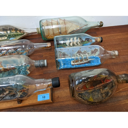 10 - Eight ships in bottles and five Cornish carved serpentine stone model lighthouses
Location: 4-4
If t... 