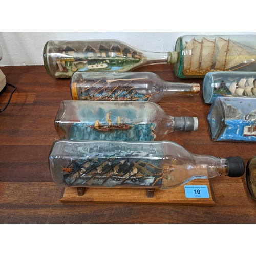 10 - Eight ships in bottles and five Cornish carved serpentine stone model lighthouses
Location: 4-4
If t... 