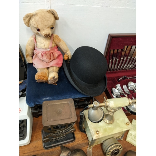 11 - A mixed lot to include a typewriter, scales, commemorative collectables, a stool, a canteen of cutle... 