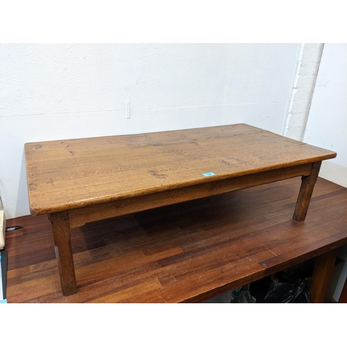 139 - A mid 20th century oak coffee table on square chamfered legs, 34cm h x 117cm w
Location: G
If there ... 