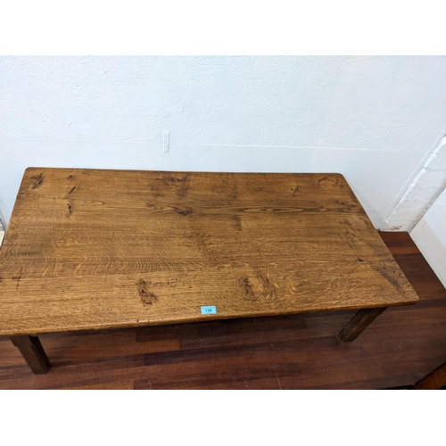 139 - A mid 20th century oak coffee table on square chamfered legs, 34cm h x 117cm w
Location: G
If there ... 