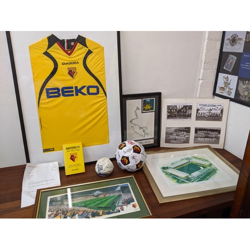 15 - Watford football related items to include a shirt, a signed football, picture and a book and other i... 