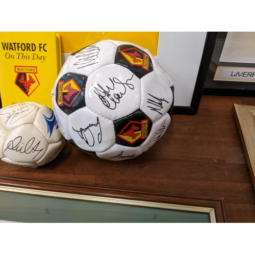 15 - Watford football related items to include a shirt, a signed football, picture and a book and other i... 